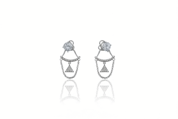 A pair of sterling silver ear jacket earrings with a round cubic zirconia stone and a chain connecting to a pavé-encrusted triangle.