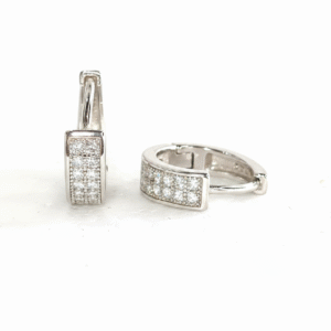 Pair of shiny silver unisex huggie hoop earrings with pave-set white cubic zirconia stones. Features a hinged snap-bar clasp and made from 925 sterling silver.