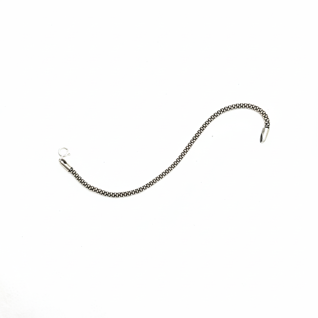 Detailed black and silver round box chain bracelet with lobster clasp.