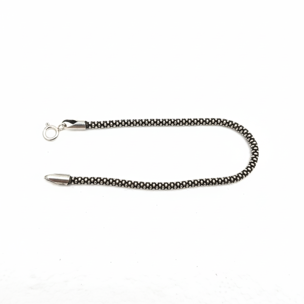 Detailed black and silver round box chain bracelet with lobster clasp.