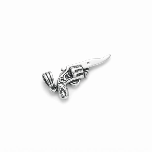 Madhisha Silvers 925 sterling silver renegade revolver gun knife hybrid charm pendant on a clean white background.