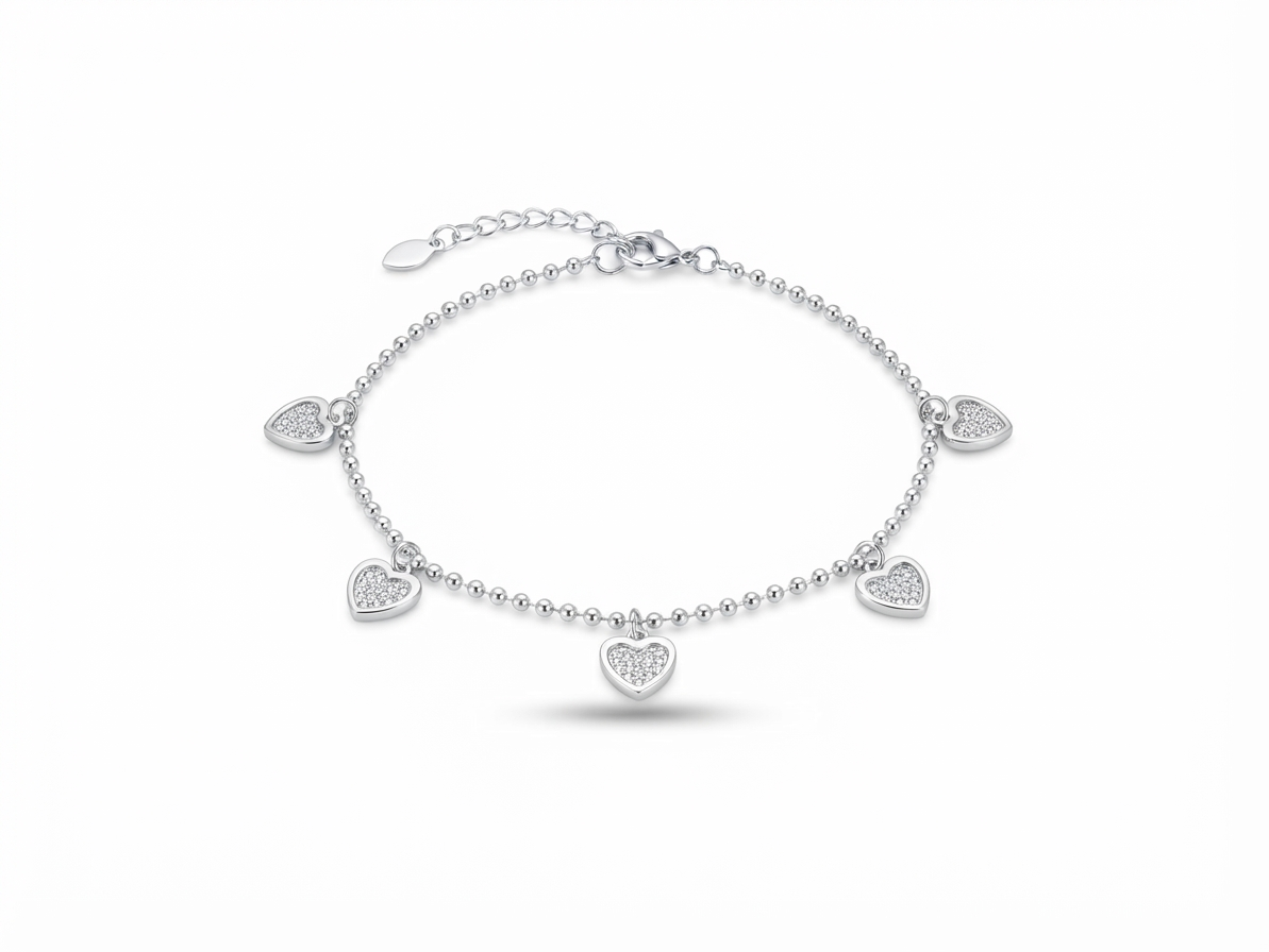 Close up of micro pave cubic zirconia heart charms on 925 silver bead chain