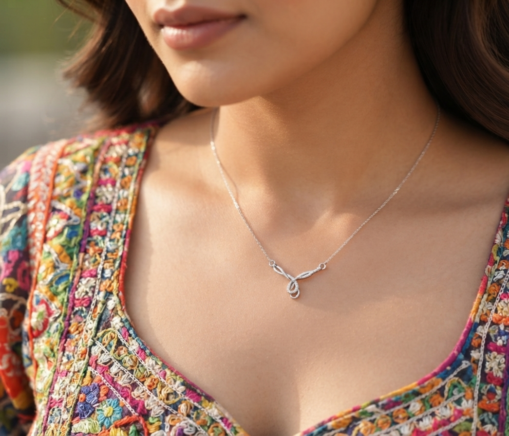 Model wearing 925 sterling silver twisted ribbon pendant on silver neck chain