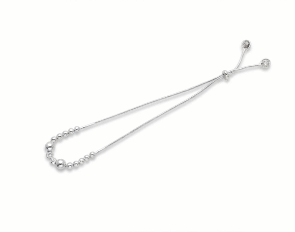 Side perspective of Madhisha 925 silver snake chain rakhi bracelet with graduating beads and slider clasp