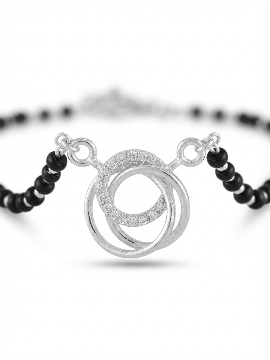Close up of CZ pave studded interlocking rings pendant on 925 silver mangalsutra